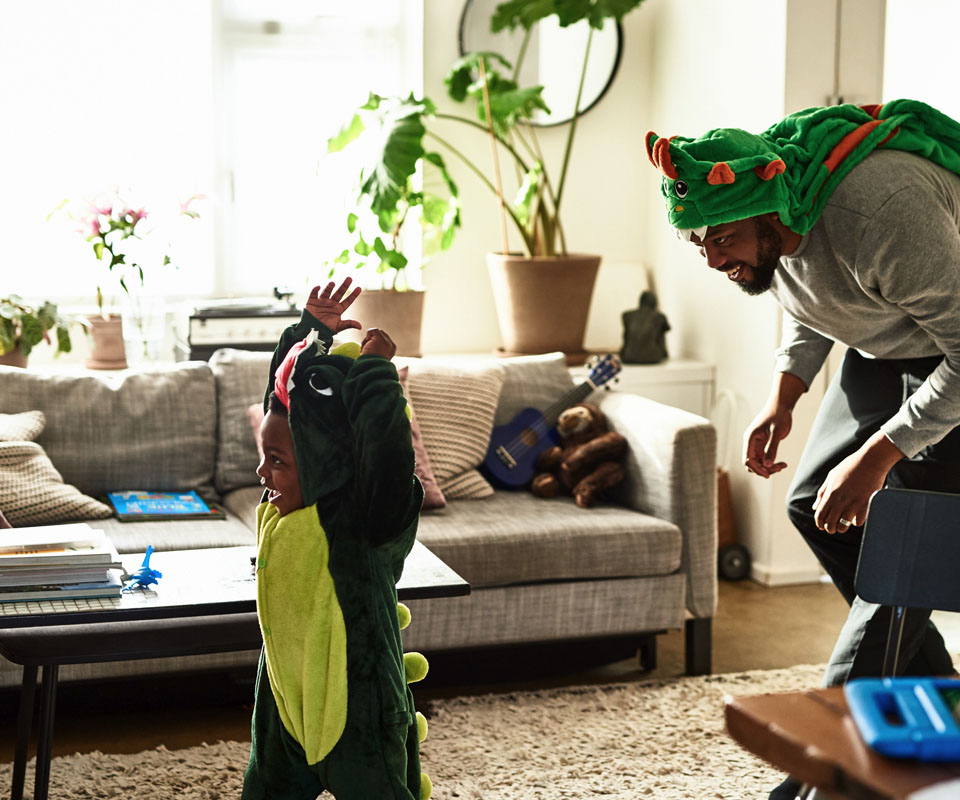 Father and son playing dress up